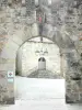 Corrèze - Margot door in foreground with view of the portal of the Saint-Martial church