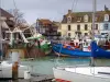 Courseulles-sur-Mer - Port with its boats and its moored trawlers, and houses of the seaside resort