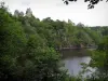 Crozant castle - Perched ruins (remains) of the fortress, trees and river