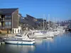 Deauville - Côte Fleurie (Flower coast): boats and sailboats in the Port-Deauville port, and residences