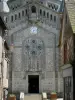 Domfront - Facade of the Saint-Julien church of Neo-Byzantine style and medieval houses