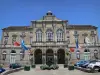 Domfront - Facade of the Town Hall in Domfront, flags and fountain