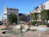 Douai - Fountains of the Armes square, trees, shops, houses and buildings