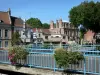 Douai - Rails decorated with flowers, trees and houses of the city