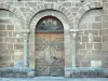 Église de Saignes - Porte de l'église romane Sainte-Croix