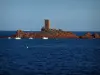Estérel massif - Or island (red rocks) with its tower, boats and the Mediterranean Sea