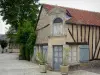 Exmes - House of the village and its door lined with shrubs in pots