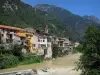 Fontan - Bell tower and houses of the village along the Roya river and mountains; in the Roya valley