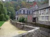 Fougères - Walk along the River Nançon, houses of the medieval town along the water and trees