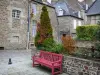 Fougères - Bench, shrubs and stone houses of the city