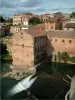 Gaillac - The River Tarn, the buildings and houses of the city, clouds in the sky