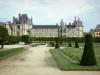 Gardens of the Palace of Fontainebleau - Large flowerbed (French-style formal garden), alleys of linden trees and facades of the Palace of Fontainebleau