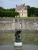 Gardens of the Palace of Fontainebleau - Pond of the waterfalls and bronze eagle statue, Sully pavilion and trees of the park in the background