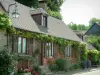 Gerberoy - Brick-built house with flowers, plants, wisterias, rosebushes and lavender