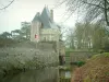 Goulaine castle - Entrance to the castle, bridge, moats and trees