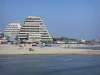 La Grande-Motte - Pyramid-shaped buildings buildings, sandy beach of the seaside resort and Mediterranean Sea