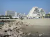 La Grande-Motte - Sandy beach, breakwaters and buildings of the seaside resort