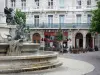 Grenoble - Place Notre-Dame square: Trois Ordres fountain, café terrace and facade of a building