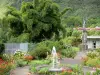 Hell-Bourg - Square of the Town Hall annex with fountain, memorial and flower beds