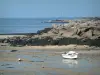 Landscapes of the Brittany coast - Low tide and small boats, coast with its rocks and its seaweeds, then sea