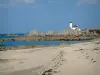 Landscapes of the Brittany coast - Sandy beach, seaweeds, the Channel (sea) and rocks and small lighthouse