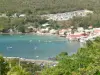 Landscapes of the Guadeloupe - View of the village of Deshaies at the seaside