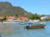 Landscapes of the Guadeloupe - Les Saintes: boats floating on the water and Terre-de-Haut houses at the seaside