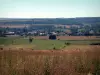 Landscapes of Lorraine - Fields with a straw bales, houses, trees and forests