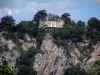 Landscapes of the Quercy - Perched residence, trees, cliffs and cloudy sky