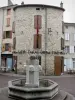 Langogne - Fontain, facades of houses and café terrace in the town