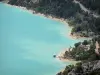 Lanscapes of Alpes-de-Haute-Provence - Emerald-coloured Sainte-Croix lake (water reservoir) and its shores lined with trees; in the Verdon Regional Nature Park