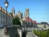 Laon - Walk along the ramparts overlooking the towers of Notre-Dame cathedral, the old bishop's palace, and the facades of the medieval town; lamppost in foreground