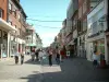 Lens - Lively pedestrian street lined with shops