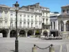Libourne - Arcaded houses, lampposts and fountain of the Place Abel Surchamp square 