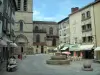 Limoges - Saint-Michel-des-Lions church and Saint-Michel square with fountain, lampposts, café terrace, shops and houses