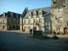 Locronan - Central square paved with an old well and beautiful stone houses (granite)