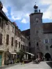 Martel - Bell tower of the Raymondie mansion, stone houses and restaurant terrace of the Consuls square, in the Quercy