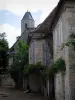 Martel - Bell tower of the Saint-Maur church and houses of the city, in the Quercy