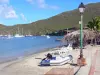 Martinique beaches - Beach of Grande Anse d'Arlet overlooking boats dotted the bay; in the town of Anse d'Arlet