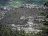 Méailles - Winding road leading to the village perched on a mountain range