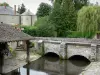Milly-la-Forêt - Stone bridge spanning the river, wash house of La Bonde with flowers, trees and Château de la Bonde