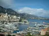 Monaco and Monte Carlo - Port of Monaco with its boats, yachts and cruise boats, buildings and mountain in background