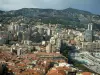 Monaco and Monte Carlo - City with its buildings, houses and swimming pool, mountain in background