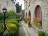 Mont-Saint-Michel - Garden, lamppost and houses of the medieval town (village)