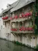 Montargis - House with flower-bedecked balconies along the water