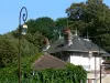 Montmorency - Lampposts, trees and roofs of houses in the city