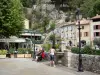 Moustiers-Sainte-Marie - Église square with fountain and lampposts, houses of the village 
