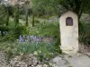 Moustiers-Sainte-Marie - Oratory, iris, low stone walls and trees