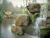 Nantes - Versailles island: small waterfall, trees and lake in the Japanese garden