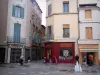 Nîmes - Facades of houses, fountains and shops in the old town